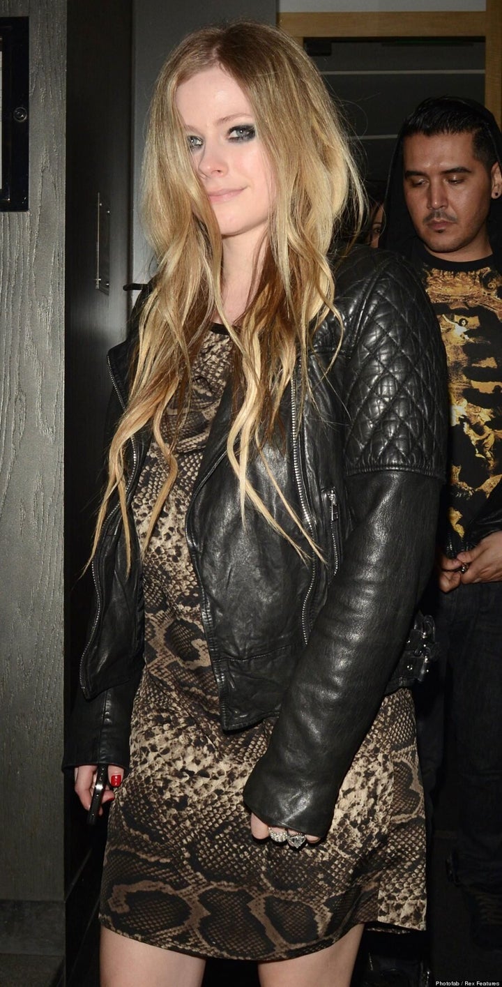 Avril Lavigne Pregnant? LooseFitting Snakeskin Dress Fuels Speculation