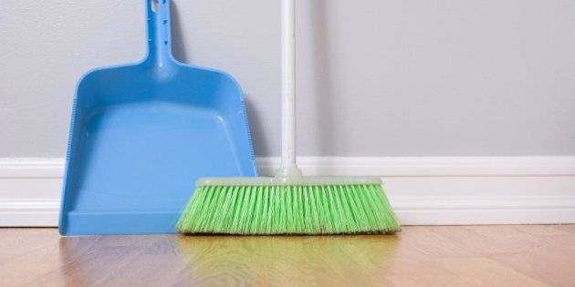 spring cleaning broom against...