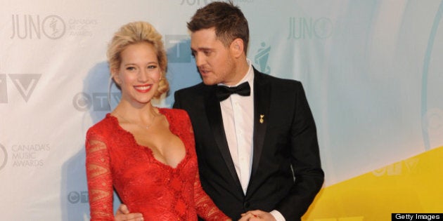 REGINA, SK - APRIL 21: Singer and host of the 2013 Juno Awards Michael Buble and his wife Luisana Lopilato arrive on the red carpet at the Brandt Centre on April 21, 2013 in Regina, Canada. (Photo by Jag Gundu/Getty Images)