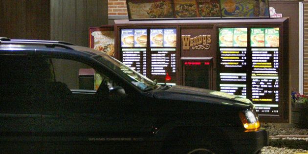 CHICAGO - JULY 15: A driver places a drive-up order at a Wendy's fast-food restaurant July 15, 2004 in Chicago, Illinois. Fast-food restaurant chains are stepping up efforts to attract late-night eaters. (Photo by Tim Boyle/Getty Images)