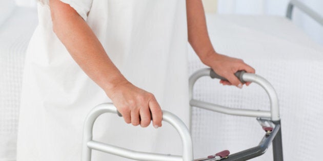 senior woman with her zimmer...