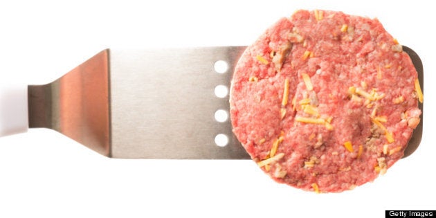 Raw Hamburger Patty Isolated on White