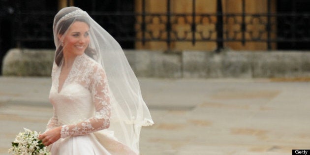 Kate Middleton smiles as she arrives at the West Door of Westminster Abbey in London for her wedding to Britain's Prince William, on April 29, 2011. AFP PHOTO / BEN STANSALL (Photo credit should read BEN STANSALL/AFP/Getty Images)