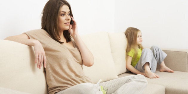 little kid girl sitting on sofa ...