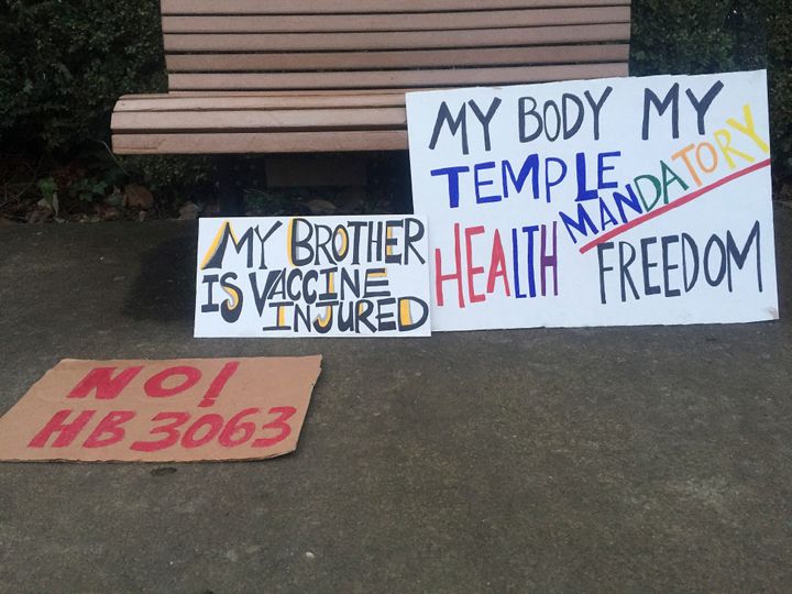Protest signs lay abandoned outside Oregon's state capitol in Salem in February following a protest over a proposal to tighten vaccination requirements for school children.