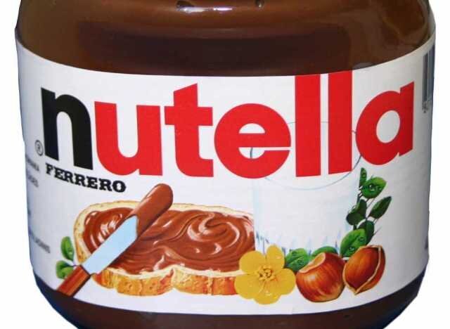 BUCHAREST, ROMANIA - FEBRUARY 25, 2015: Nutella Jar Close Up. From 1964  Nutella Is The Name Of An Italian Sweetened Hazelnut Chocolate Spread  Manufactured By The Italian Company Ferrero. Stock Photo, Picture
