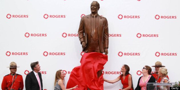 TORONTO, ON- JULY 23 - the A ststue of Ted Rogers is unveiled by his wife and children outside the Rogers Centre, July 23, 2013. (Steve Russell/Toronto Star via Getty Images)