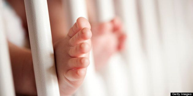 Baby's feet in the cradle