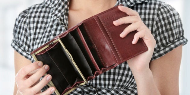 Young caucasian woman with empty wallet - broke