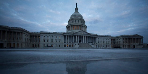 The U.S. Capitol stands in Washington, D.C., U.S., on Friday, Sept. 27, 2013. House Speaker John Boehner's plan to avert a shutdown by shifting to a debt-ceiling fight ran into opposition from some Republicans in another setback for efforts to keep the U.S. government operating after Sept. 30. Photographer: Andrew Harrer/Bloomberg via Getty Images