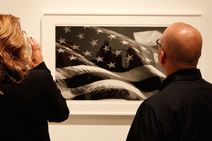 Guests perusing art at the event