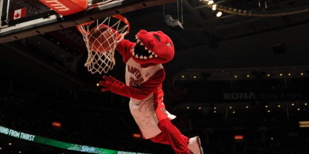 TORONTO, CANADA - APRIL 3: The mascot of the Toronto Raptors dunks the ball against the Washington Wizards during the game on April 3, 2013 at the Air Canada Centre in Toronto, Ontario, Canada. NOTE TO USER: User expressly acknowledges and agrees that, by downloading and or using this Photograph, user is consenting to the terms and conditions of the Getty Images License Agreement. Mandatory Copyright Notice: Copyright 2013 NBAE (Photo by Ron Turenne/NBAE via Getty Images)
