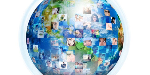 A globe is isolated on a white background with many different people's faces. Can represent a technology social network of friends and communication.