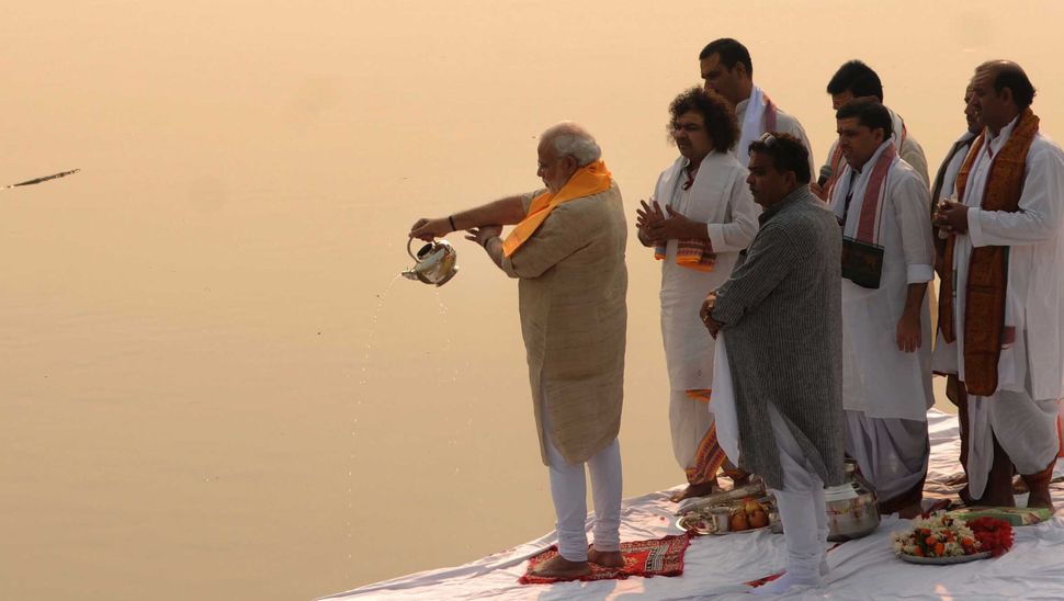 Prime Minister Narendra Modi performing Ganga aarti pooja after cleaning Assi ghat on November 8, 2014 in Varanasi, India.