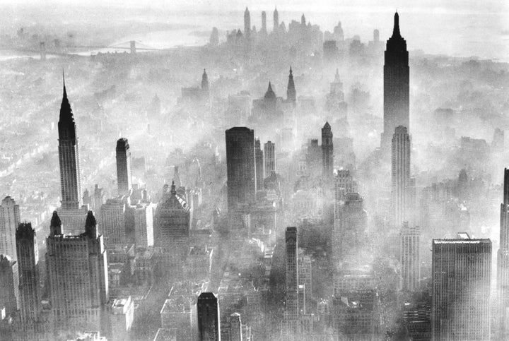 View of the city skyline partially obscured by smog, New York City, 1973.