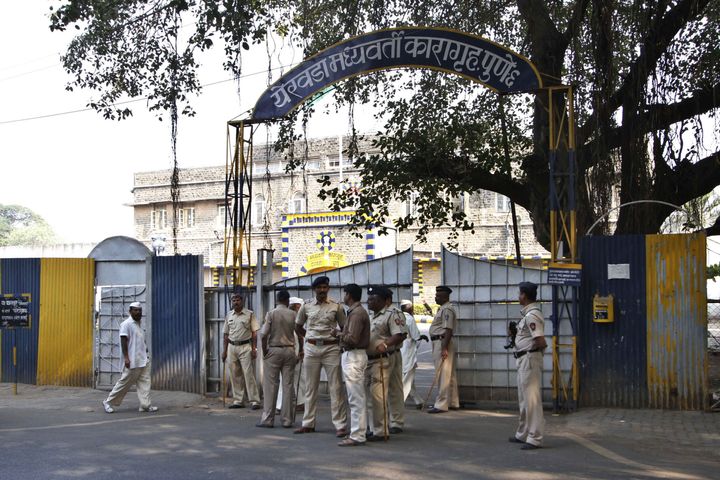 Indian policemen stand outside the Yerwada Jail in 2012.