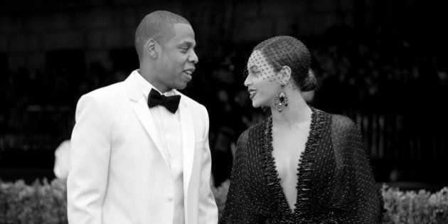 NEW YORK, NY - MAY 05: (EDITORS NOTE: Image was converted to black and white.) Jay-Z (L) and Beyonce attend the 'Charles James: Beyond Fashion' Costume Institute Gala at the Metropolitan Museum of Art on May 5, 2014 in New York City. (Photo by Mike Coppola/Getty Images)