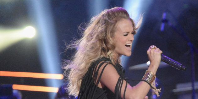 NASHVILLE, TN - JUNE 04: Carrie Underwood and Miranda Lambert perform during the 2014 CMT Music awards at the Bridgestone Arena on June 4, 2014 in Nashville, Tennessee. (Photo by Jeff Kravitz/FilmMagic)