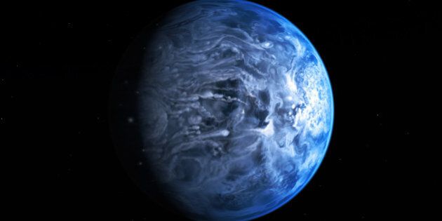 In this undated illustration provided by the European Space Agency (ESA), an artists impression of one of Earth's nearest planets outside the solar system named HD 189733B. Astronomers said Friday, July 12, 2013 that for the first time they had gained an understanding of HD 189733B, which is around 63 light years away by discovering the huge gas giantâs blue color. To ascertain the planetâs color the astronomers measured the amount of light reflected of its surface as it eclipsed its host star. (AP Photo/ESA-Hubble, M. Kornmesser)