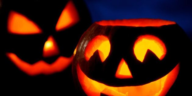 Scary halloween pumpkins jack-o-lantern on black background