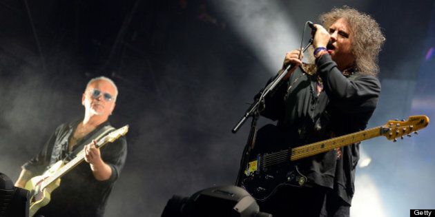 CHICAGO, IL - AUGUST 04: Reeves Gabrels and Robert Smith of The Cure perform during Lollapalooza 2013 at Grant Park on August 4, 2013 in Chicago, Illinois. (Photo by Theo Wargo/Getty Images)