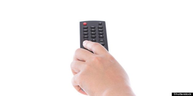 woman hand with remote control...