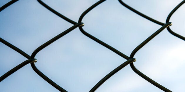 Fence with a clear sky on the background.