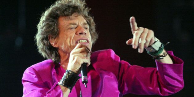 TORONTO, CANADA - JULY 30: Mick Jagger of the Rolling Stones performs during the SARS relief concert held at Downsview Park July 30, 2003 in Toronto, Canada. An estimated 490,000 fans showed up for the daylong music festival headed by the Rolling Stones. (Photo by Donald Weber/Getty Images)
