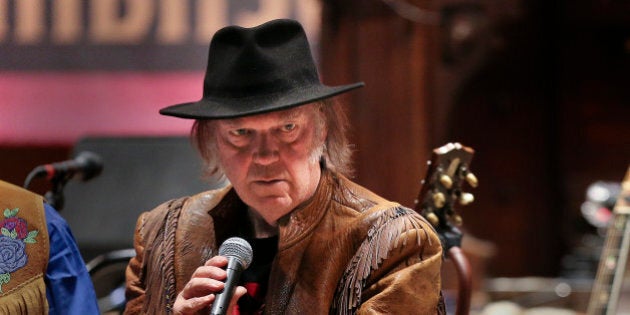 TORONTO, ON - JANUARY 12: Young speaks to the media on the stage that is already prepped for his evening concert. Famed singer, Neil Young held a news conference on Jan. 12 to tout his benefit concert that same day raising money and awareness for the Athabasca Chipewyan First Nation Legal Defense Fund. The event was held at Massey Hall. January 12, 2014. (Richard Lautens/Toronto Star via Getty Images)