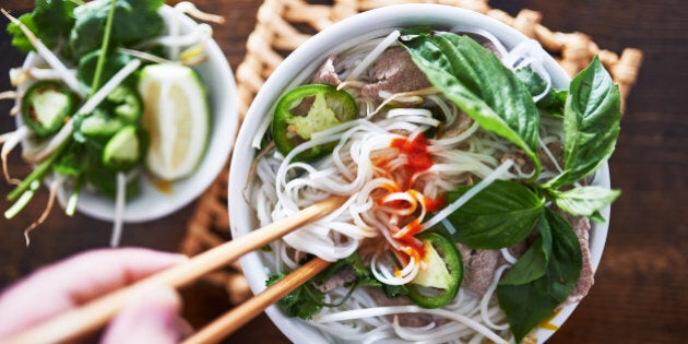 vietnamese pho with spicy sriracha sauce shot top down