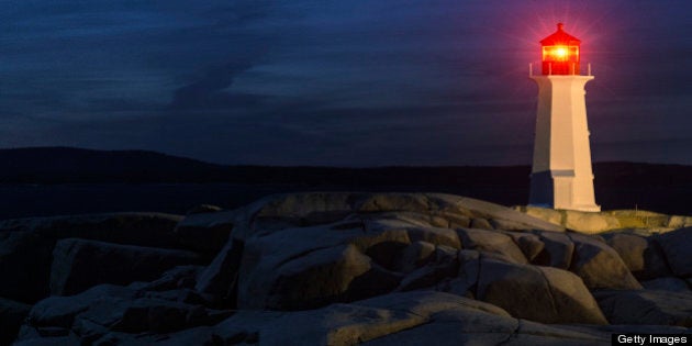 Comet Pan-STARRS hangs in deep twilight over Peggy's Cove Lighthouse. Long exposure at high iso.