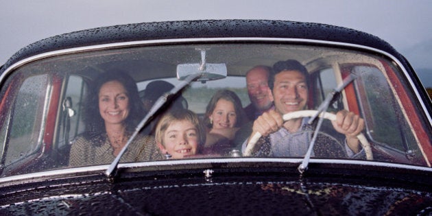 Family in vintage car, smiling, portrait