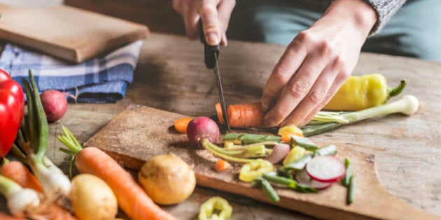 Woman Chopping food ingredients