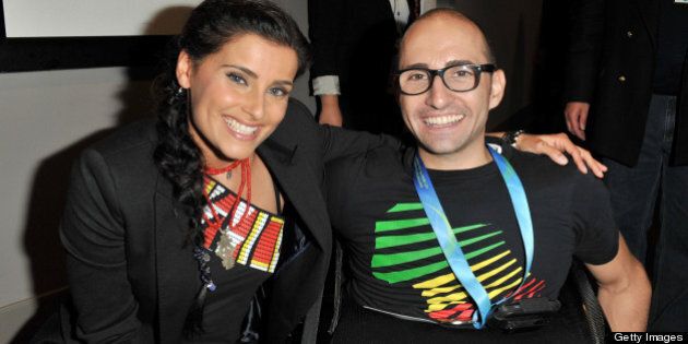 TORONTO, ON - SEPTEMBER 27: Singer Nelly Furtado and Spencer West attend Free The Children's We Day at the Air Canada Centre on September 27, 2011 in Toronto, Canada. (Photo by George Pimentel/WireImage)