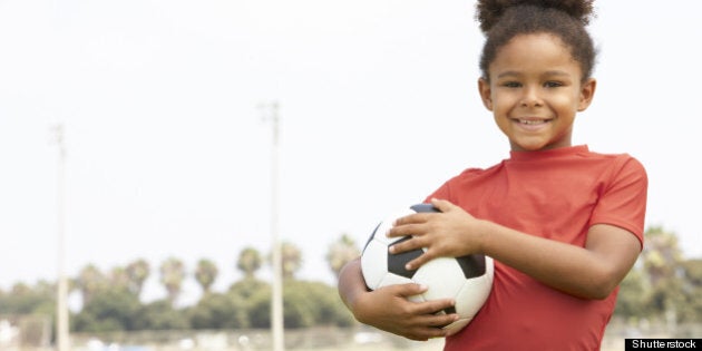 young girl in football team