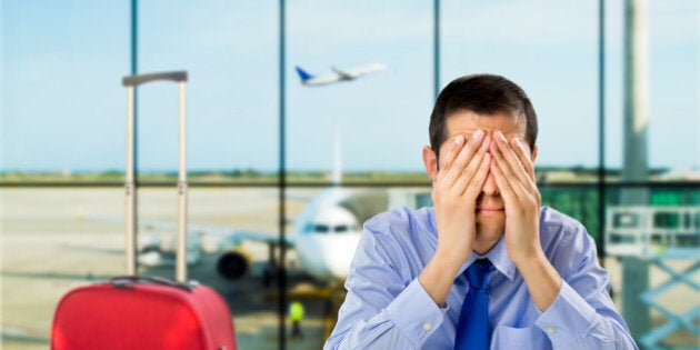 crying businessman who delayed flight at an airport