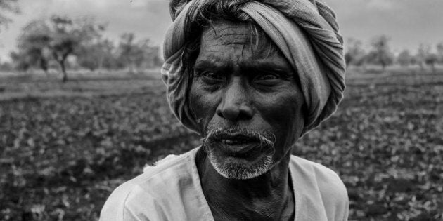 Black and white portrait of aged Indian farmer