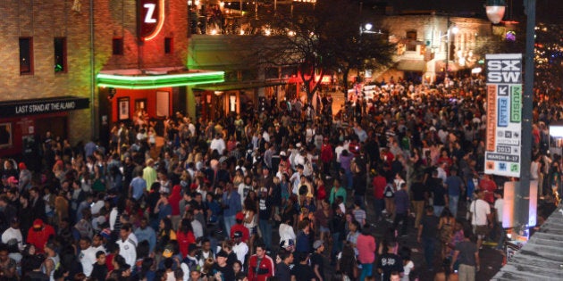 AUSTIN, TX - MARCH 15: Crowds of festival music fans on 6th Street during Day 4 of SXSW 2013 Music Festival on March 15, 2013 in Austin, Texas. (Photo by Andy Sheppard/Redferns via Getty Images)