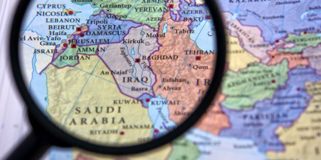 Syria and the Middle East seen through a magnifying glass, which helps focus on certain countries.