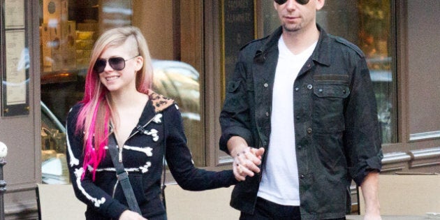 PARIS, FRANCE - SEPTEMBER 13: Singer Avril Lavigne and Chad Kroeger are seen strolling on September 13, 2012 in Paris, France. (Photo by Marc Piasecki/FilmMagic)