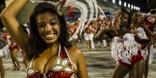 Dancers of Unidos de Padre Miguel samba school rehearse at Sambadromo in Rio de Janeiro, Brazil on January 19, 2014. Rio's carnival will have a peak on March 2 and 3, 2014. AFP PHOTO / YASUYOSHI CHIBA (Photo credit should read YASUYOSHI CHIBA/AFP/Getty Images)