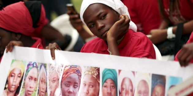 Bring Back Our Girls (BBOG) campaigners look on during a protest procession marking the 500th day since the abduction of girls in Chibok, along a road in Abuja August 27, 2015. The Islamist militant group Boko Haram kidnapped some 270 girls and women from a school in Chibok a year ago. More than 50 eventually escaped, but at least 200 remain in captivity, along with scores of other girls kidnapped before the Chibok girls. REUTERS/Afolabi Sotunde