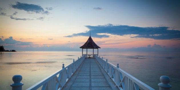 The picturesque setting of Half Moon Beach illuminated at dusk