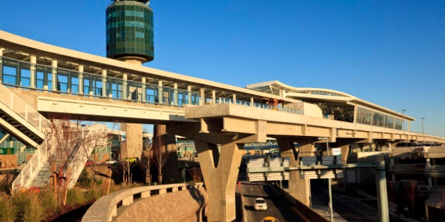 Taxis approaching the the arrivals level at the Vancouver International Airport, Richmond British Columbia Canada.