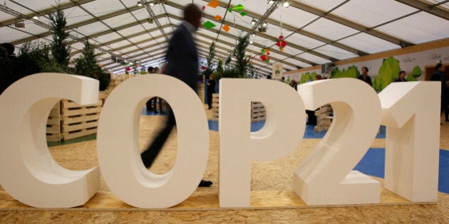 A man visits the Climate Generations Areas, part of the COP21, the United Nations Climate Change Conference Tuesday, Dec. 1, 2015 in Le Bourget, north of Paris. (AP Photo/Christophe Ena)