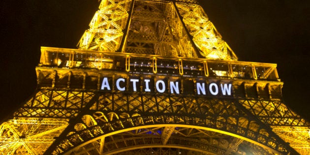 The Eiffel Tower lights up with the slogan