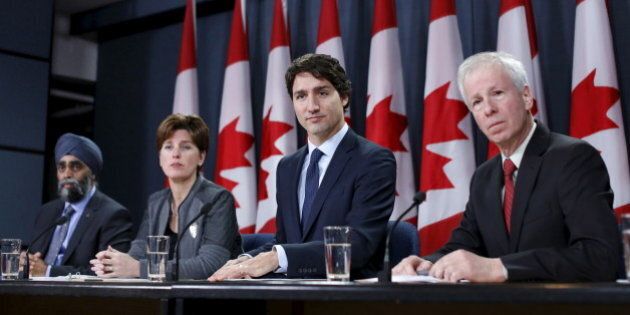 Canada's Prime Minister Justin Trudeau (2nd R) takes part in a news conference with Defence Minister Harjit Sajjan (L), International Development Minister Marie-Claude Bibeau (2nd L) and Foreign Minister Stephane Dion in Ottawa, Canada, February 8, 2016. REUTERS/Chris Wattie