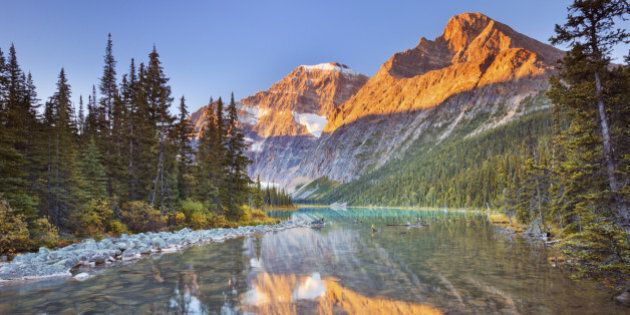 Mount Edith Cavell reflected in Cavell Lake in Jasper National Park, Canada. Photographed at sunrise.
