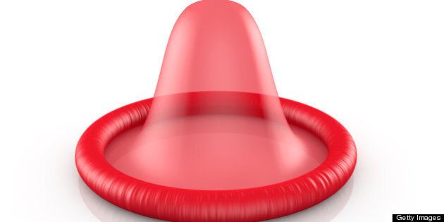 A red condom on a white background