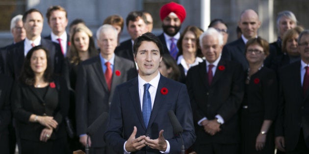 OTTAWA, Nov. 4, 2015-- Newly elected Canadian Prime Minister Justin Trudeau, front, delivers a statement after his swearing in ceremony at Rideau Hall in Ottawa, Canada, Nov. 4, 2015. Justin Trudeau was sworn in as Canada's 23rd prime minister and named a 31-member cabinet here Wednesday. (Xinhua/Chris Roussakis via Getty Images)